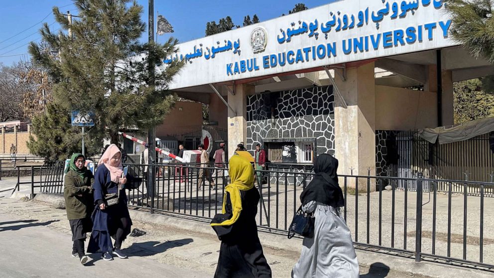 PHOTO: FILE - Female students walk in front of the Kabul Education University in Kabul, Afghanistan, Feb. 26, 2022.