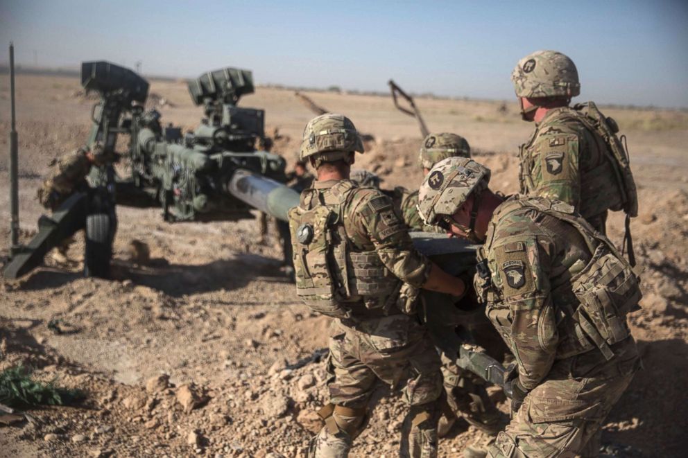 PHOTO: U.S. Soldiers with Task Force Iron maneuver an M-777 howitzer, so it can be towed into position at Bost Airfield, Afghanistan, June 10, 2017.