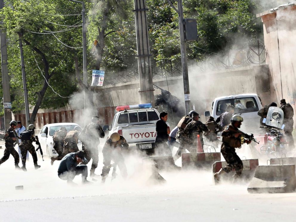 PHOTO: Security forces run from the site of a suicide attack after the second explosion in Kabul, April 30, 2018. A coordinated double suicide bombing hit central Kabul.