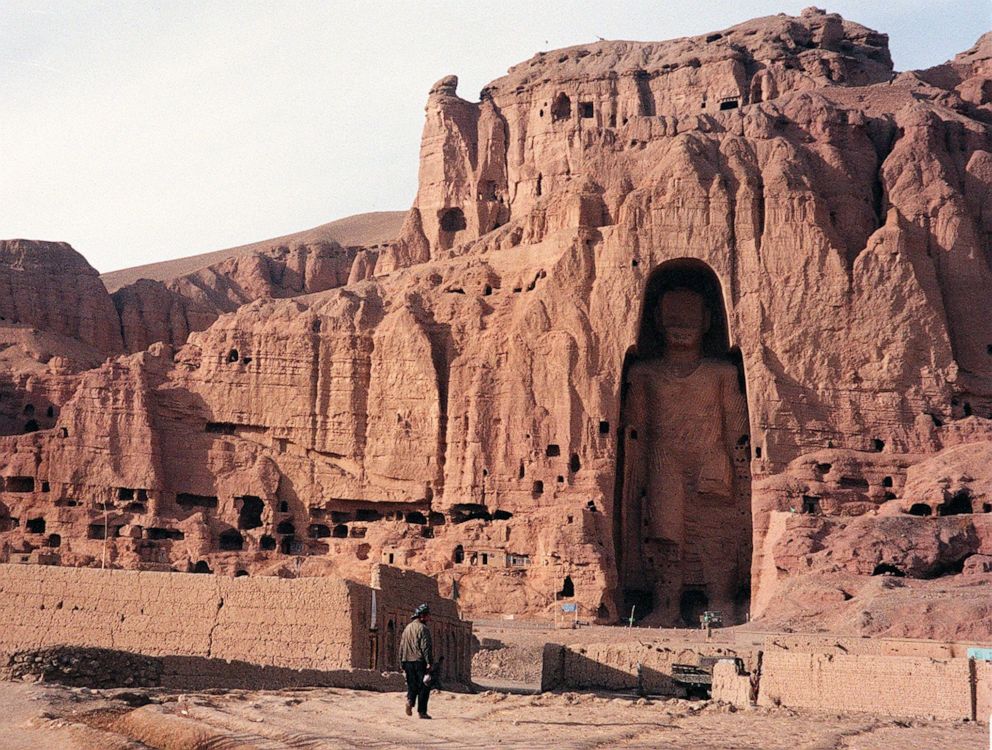 PHOTO: A photo dated Dec. 7, 1997, shows an Afghan walking near the world's tallest standing statue of Buddha in Bamiyan province of Afghanistan.