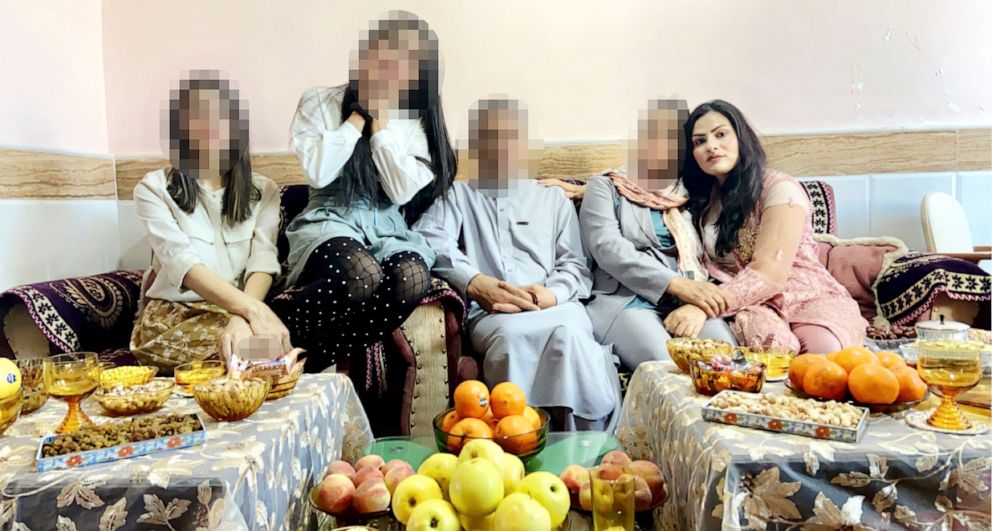 PHOTO: "Sarina" poses with her family for a photo at their home in Afghanistan in 2021.