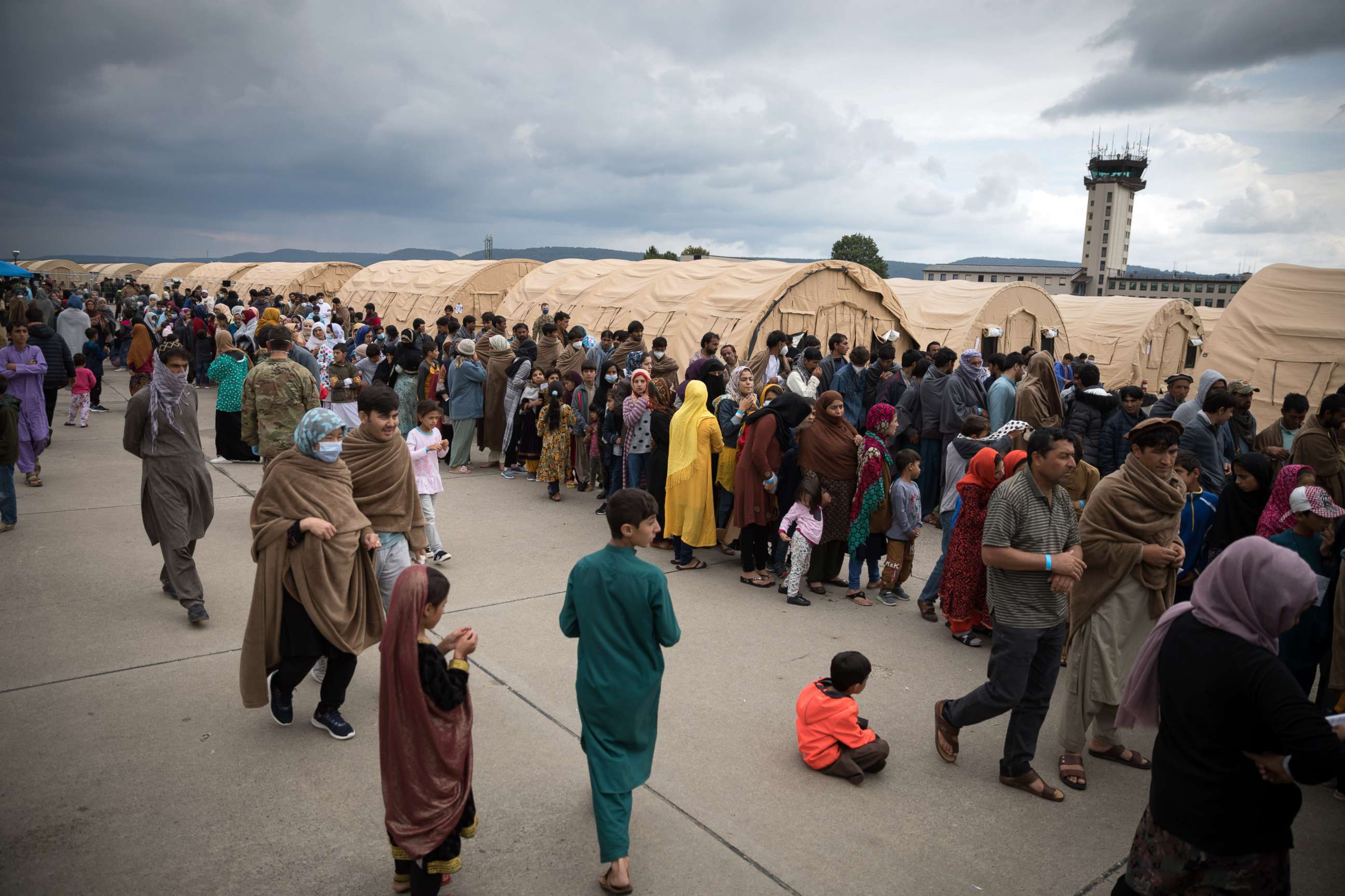PHOTO: People evacuated from Afghanistan line up for food at Ramstein Air Base in the German state of Rhineland-Palatinate on Aug. 30, 2021.