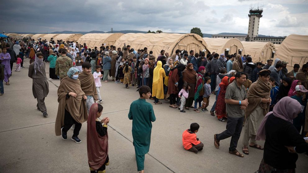 PHOTO: People evacuated from Afghanistan line up for food at Ramstein Air Base in the German state of Rhineland-Palatinate on Aug. 30, 2021.