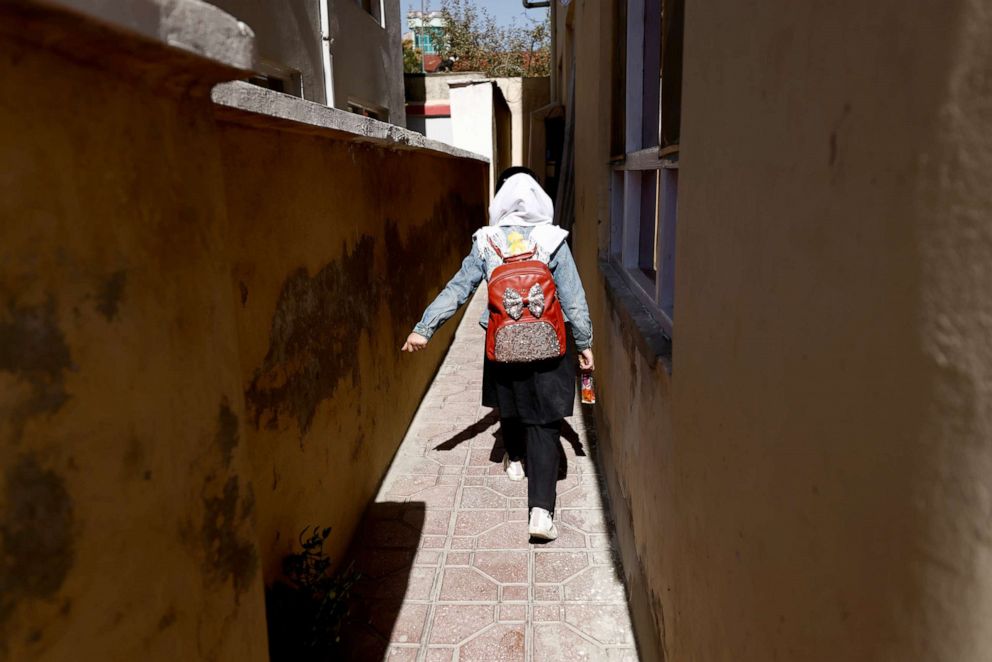 PHOTO: Hadia, 10, a 4th grade primary school student, walks back from school through an alleyway near her home in Kabul, Afghanistan, Oct. 20, 2021.
