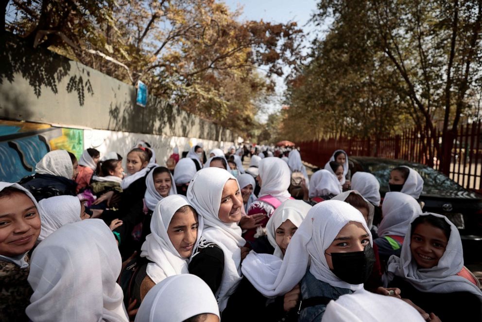 PHOTO: Female primary school students leave school after a class in Kabul, Afghanistan, Oct. 25, 2021.