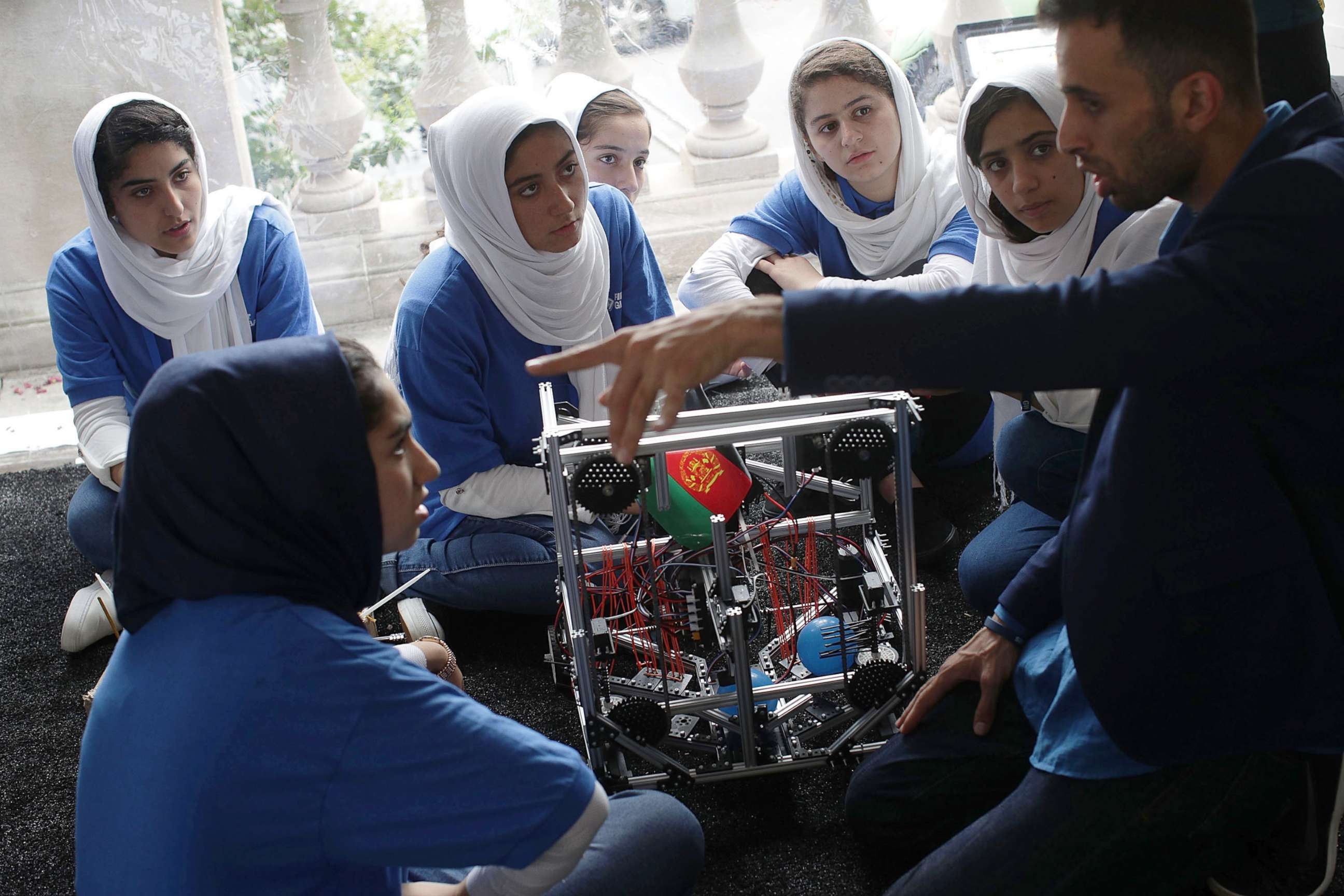 PHOTO: Team Afghanistan listen to coach Alireza Mehraban during the first of two days of the First Global International Robot Olympics, an international robotic challenge, July 17, 2017 at DAR Constitution Hall in Washington, D.C.