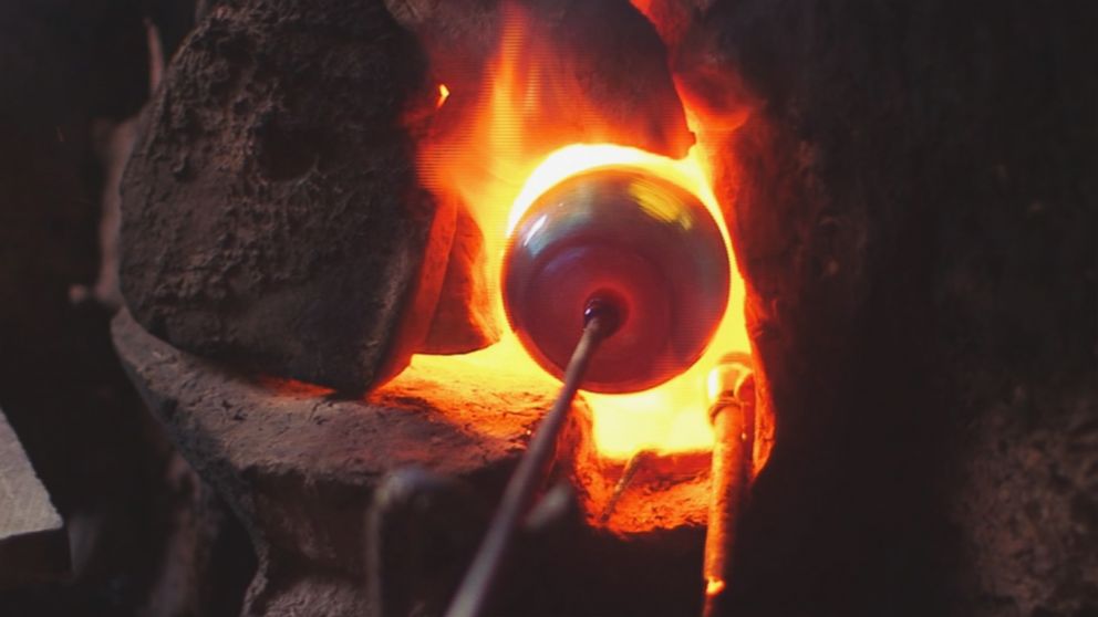 PHOTO: A glassblower practices his craft in the western Afghanistan city of Herat.