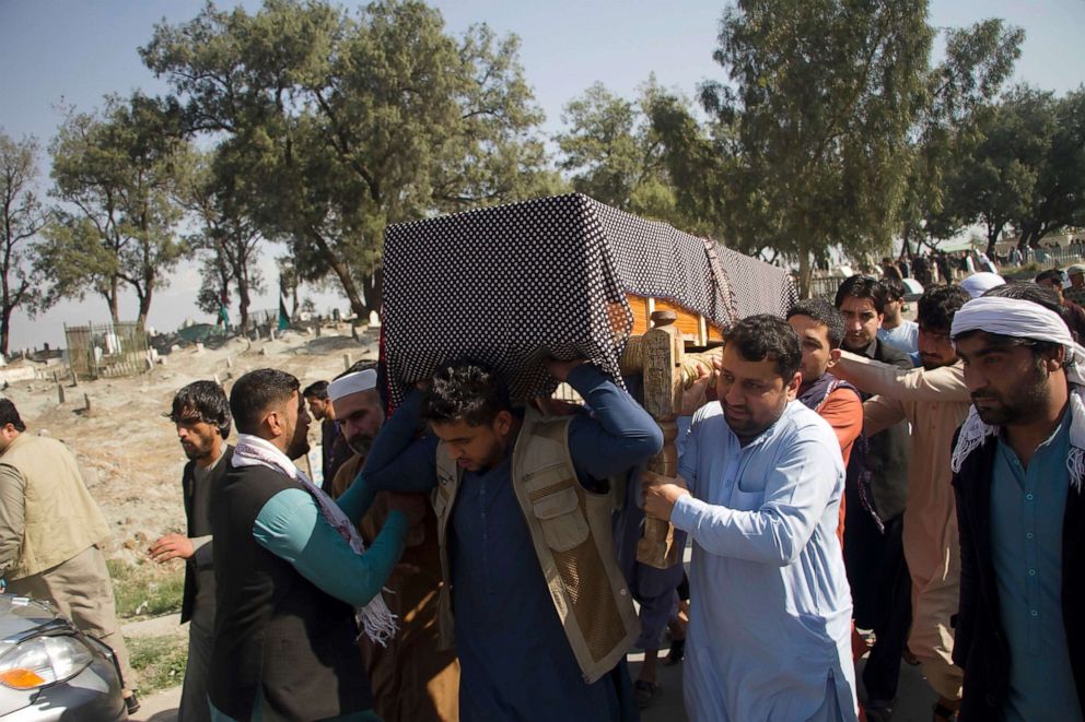PHOTO: Relatives carry the body of one of three women working for a local radio and TV station who were killed on Tuesday in attacks claimed by the Islamic State group, during her funeral ceremony in Jalalabad, east of Kabul, Afghanistan, March 3, 2021.