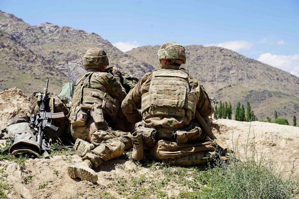 PHOTO: In this June 6, 2019, file photo, US soldiers look out over hillsides during a visit of the commander of US and NATO forces in Afghanistan General Scott Miller at the Afghan National Army (ANA) checkpoint in Nerkh district of Wardak province.