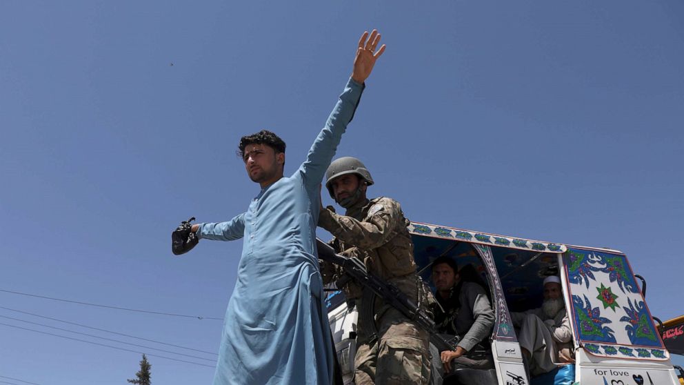 PHOTO: Afghan security police search a man at a checkpoint in Jalalabad, Afghanistan, April 21, 2021. 