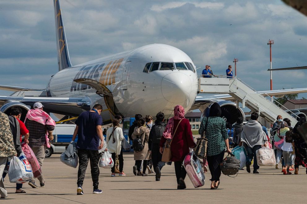 PHOTO: Evacuees board an Atlas Air aircraft for a departure flight from Ramstein Air Base, Germany, on their way to the United States as part of Operations Allies Refuge, Aug. 24, 2021.