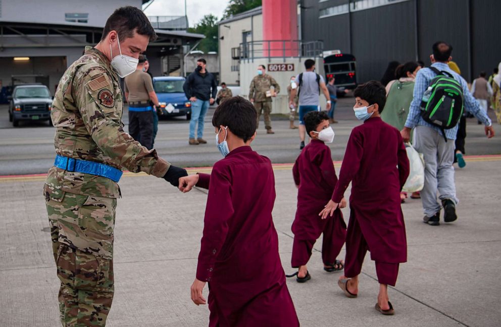 PHOTO: Evacuees prepare to board a plane to the United States at Ramstein Air Base, Germany, Aug. 23, 2021.
