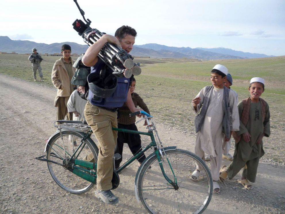 PHOTO: ABC News Senior Foreign Correspondent Ian Pannell borrows a child's bicycle in Afghanistan in 2009.