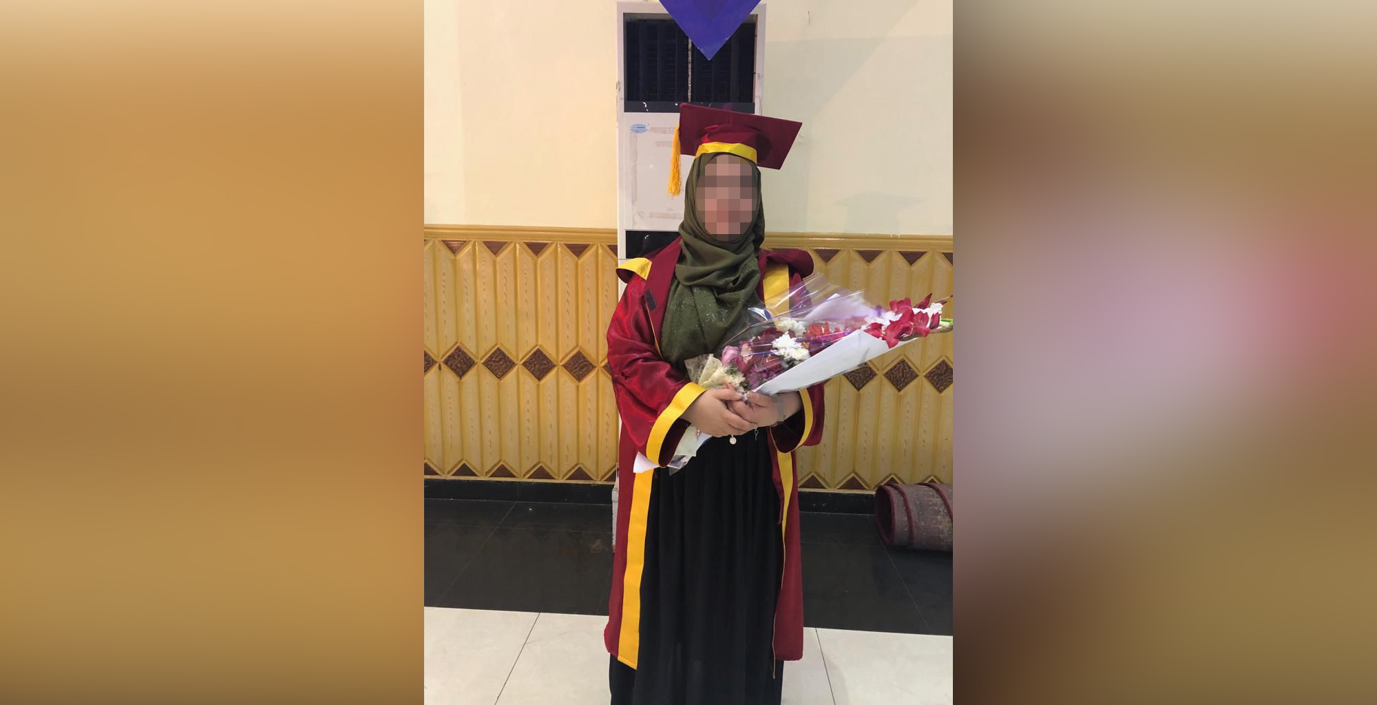 PHOTO: An Afghan woman, whose name is being withheld for security concerns, graduates from university in a 2018 family photo.