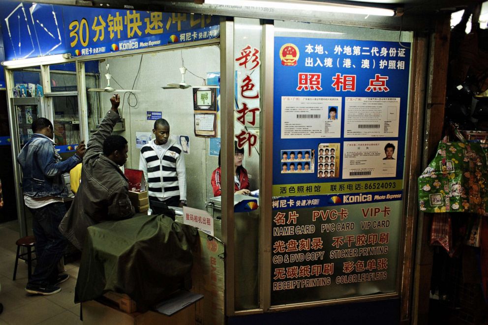 PHOTO: An African trader at a photo shop to have some prints made of photos to send back home, Dec. 17, 2008, in Guangzhou, China.