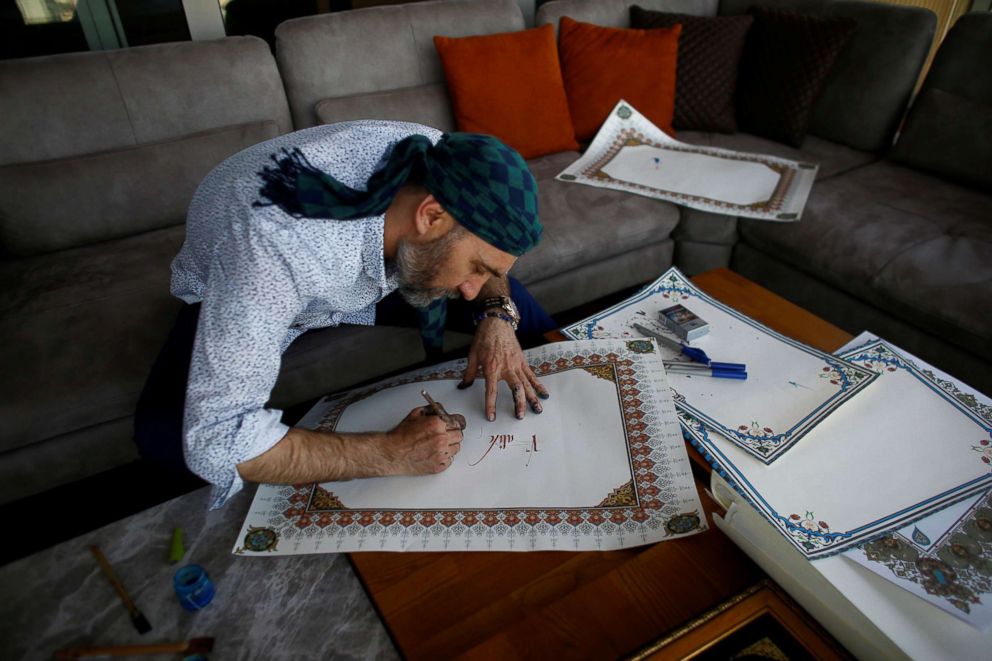 PHOTO: Senior Police Chief and Former Deputy Head of Terror Division, Ahmet Sula, works on a painting in Istanbul, Turkey, April 5, 2018.