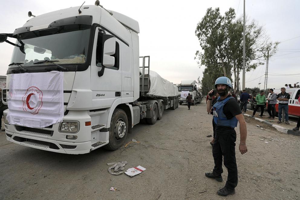 PHOTO: Trucks carrying humanitarian aid wait to cross from the southern Gaza Strip into the northern Gaza Strip along Salah Al Din road in the central Gaza Strip, on Nov. 25, 2023. 