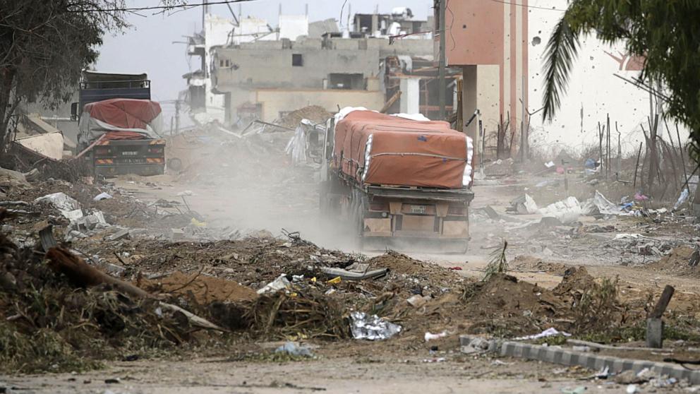 PHOTO: Trucks carrying humanitarian aid cross from the southern Gaza Strip into the northern Gaza Strip along Salah Al Din road in the central Gaza Strip, on Nov. 25, 2023. 