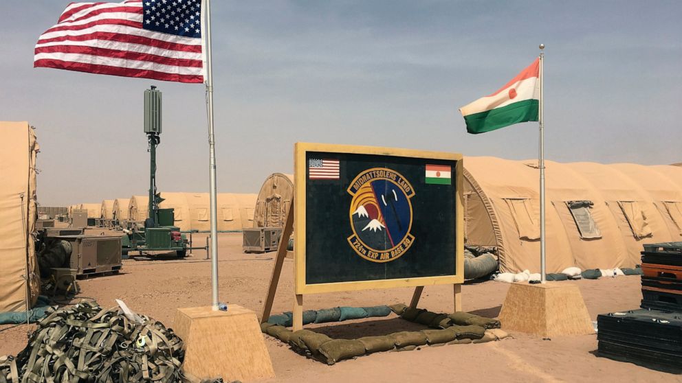 PHOTO: In this photo taken Monday, April 16, 2018, a U.S. and Niger flag are raised side by side at the base camp for air forces and other personnel supporting the construction of Niger Air Base 201 in Agadez, Niger.