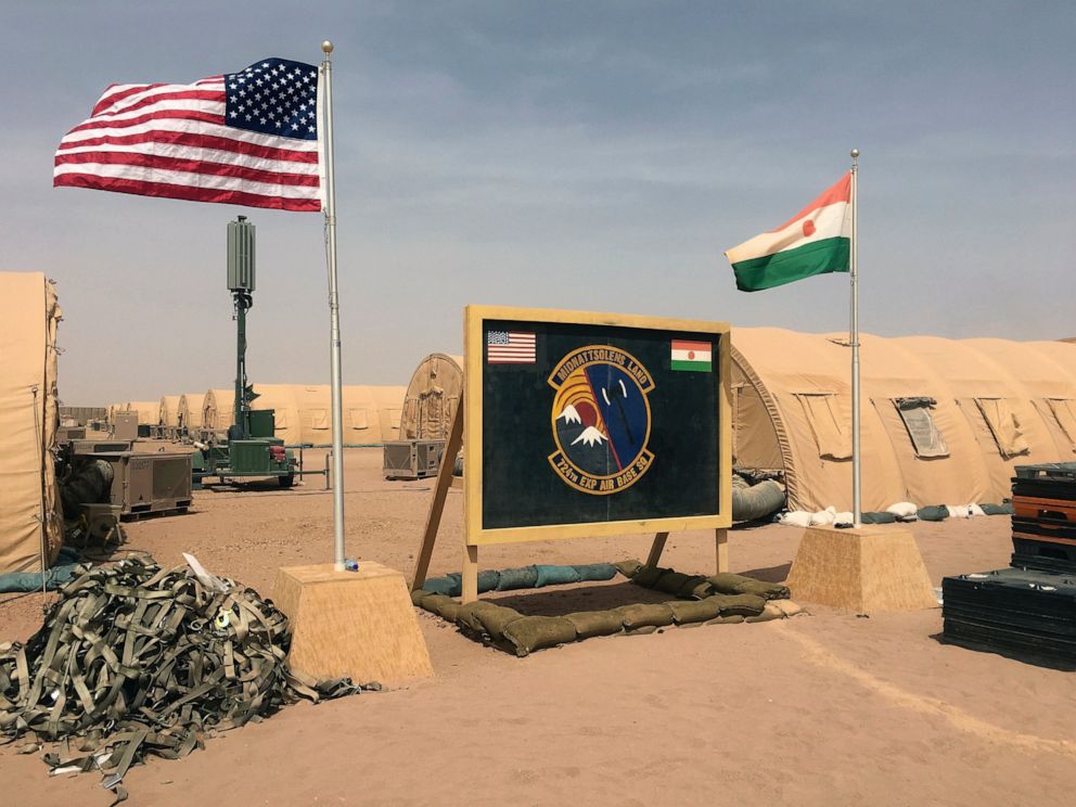 PHOTO: In this photo taken Monday, April 16, 2018, a U.S. and Niger flag are raised side by side at the base camp for air forces and other personnel supporting the construction of Niger Air Base 201 in Agadez, Niger.