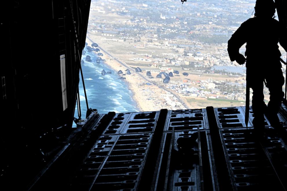 PHOTO: In this image obtained from the US Department of Defense, a US Air Force loadmaster releases humanitarian aid pallets of food and water over Gaza, March 2, 2024. 