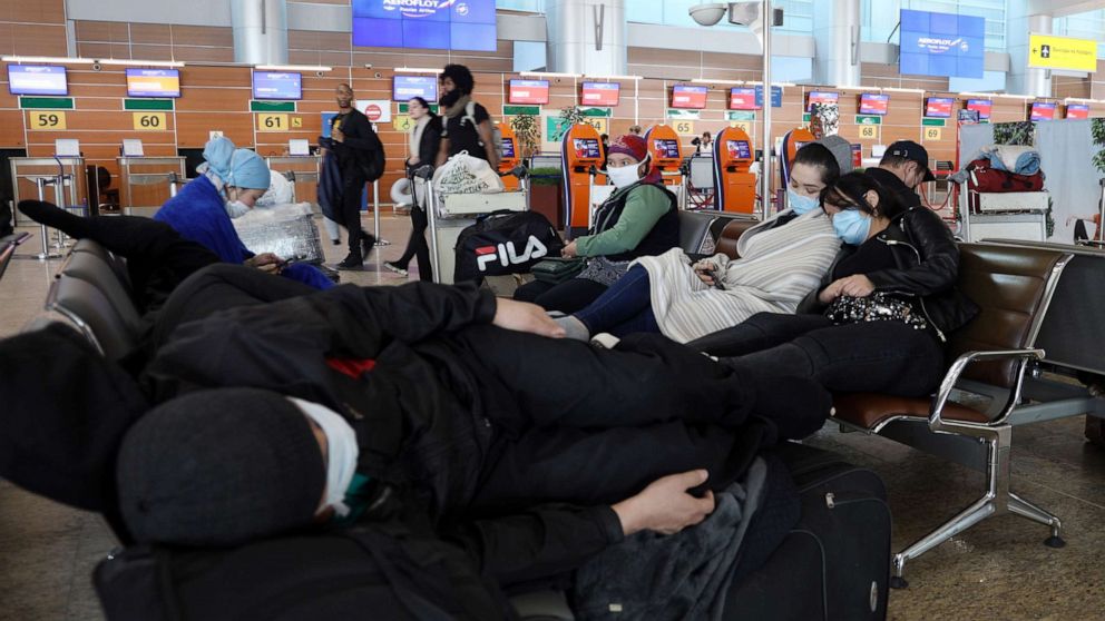 Passengers at Sheremetyevo International Airport sit on the first day of an international flight ban ordered by the government amid the ongoing COVID-19 pandemic and effective since March 27.Marina Lystseva/TASS/Newscom