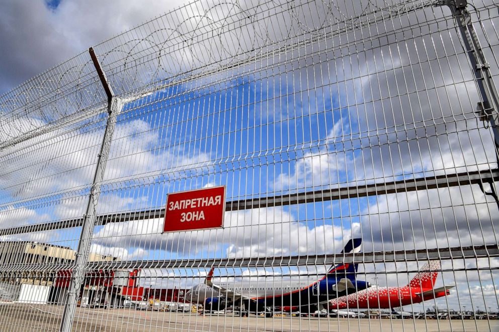 PHOTO: An Aeroflot plane is seen behind a fence at Sheremetyevo airport in Moscow, April 4, 2020. 