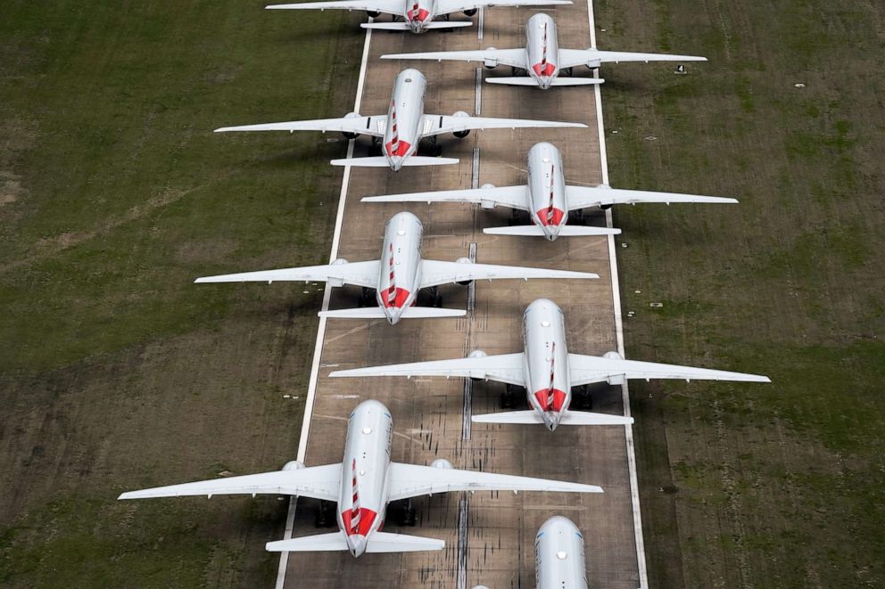 PHOTO: American Airlines passenger planes crowd a runway at Tulsa International Airport where they are parked due to flight reductions because of the coronavirus pandemic, March 23, 2020, in Tulsa, Okla.