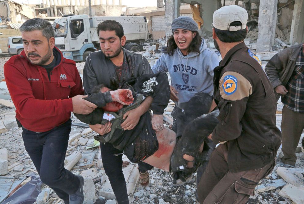 PHOTO: Syrian men carry a wounded man following a reported airstrike on the rebel-held town of Atareb in Syria's northern Aleppo province, Nov. 13, 2017.
