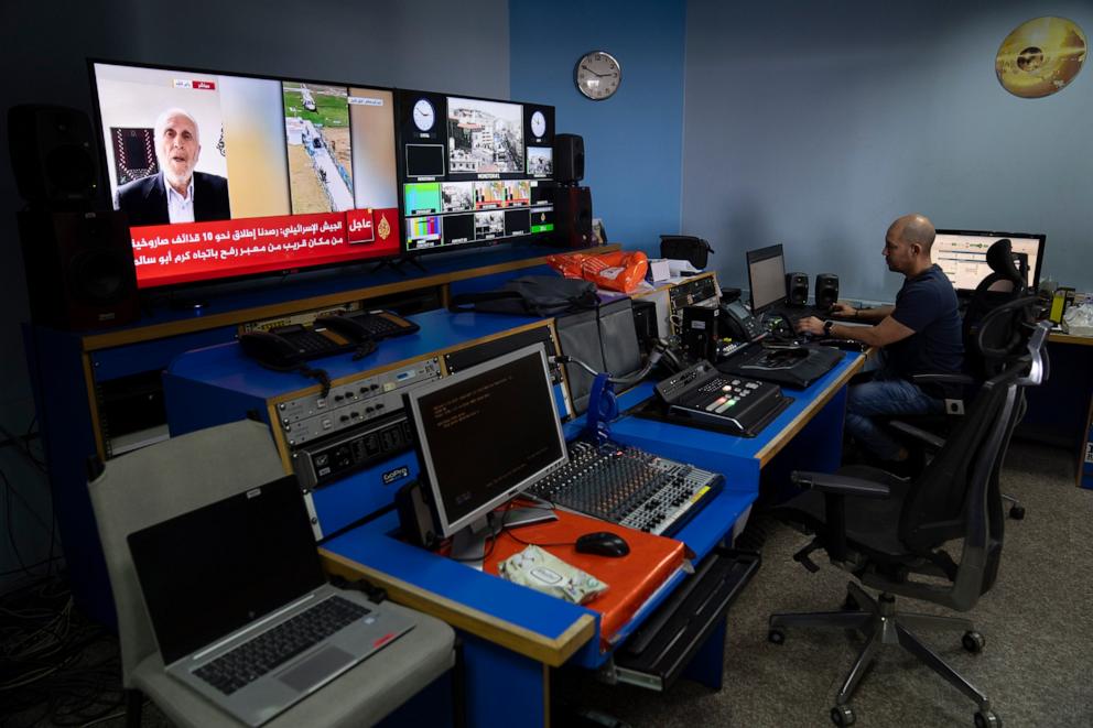 PHOTO: Al Jazeera broadcast engineer Mohammad Salameh works at the Master Control Room unit inside the network's office in the West Bank city of Ramallah on May 5, 2024.