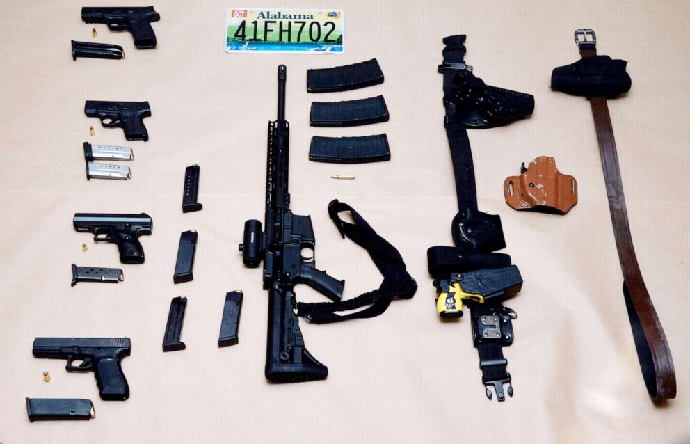 PHOTO: Weapons collected from the Cadillac sedan driven by Alabama fugitives Casey White and Vicky White are displayed during a press conference at the Vanderburgh County Sheriff's office in Evansville, Ind., May 10, 2022.
