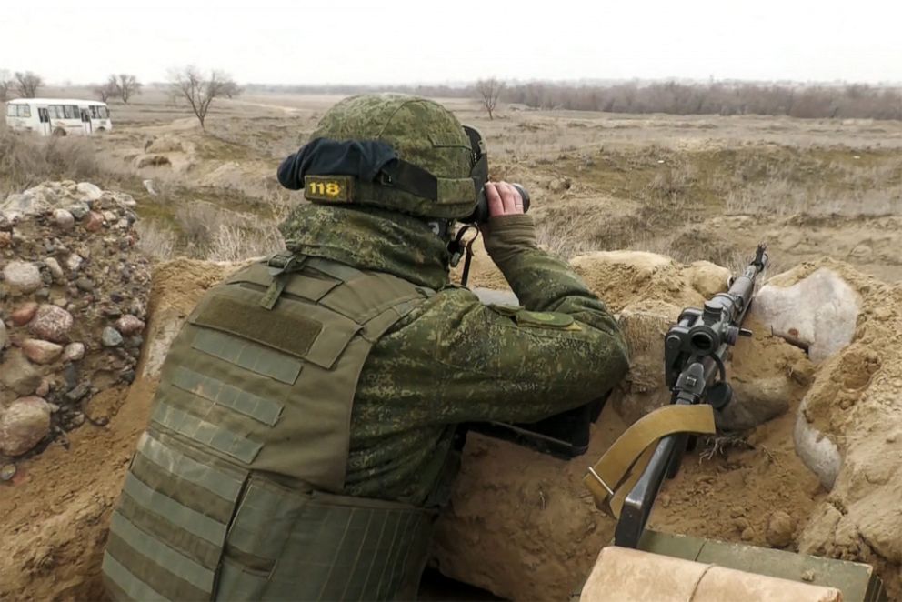 PHOTO: A Collective Security Treaty Organization's (CSTO) Belarus soldier observes with binoculars at Zhetygen airport,  north of Alamaty, in Kazakhstan, ?Jan. 11, 2022.