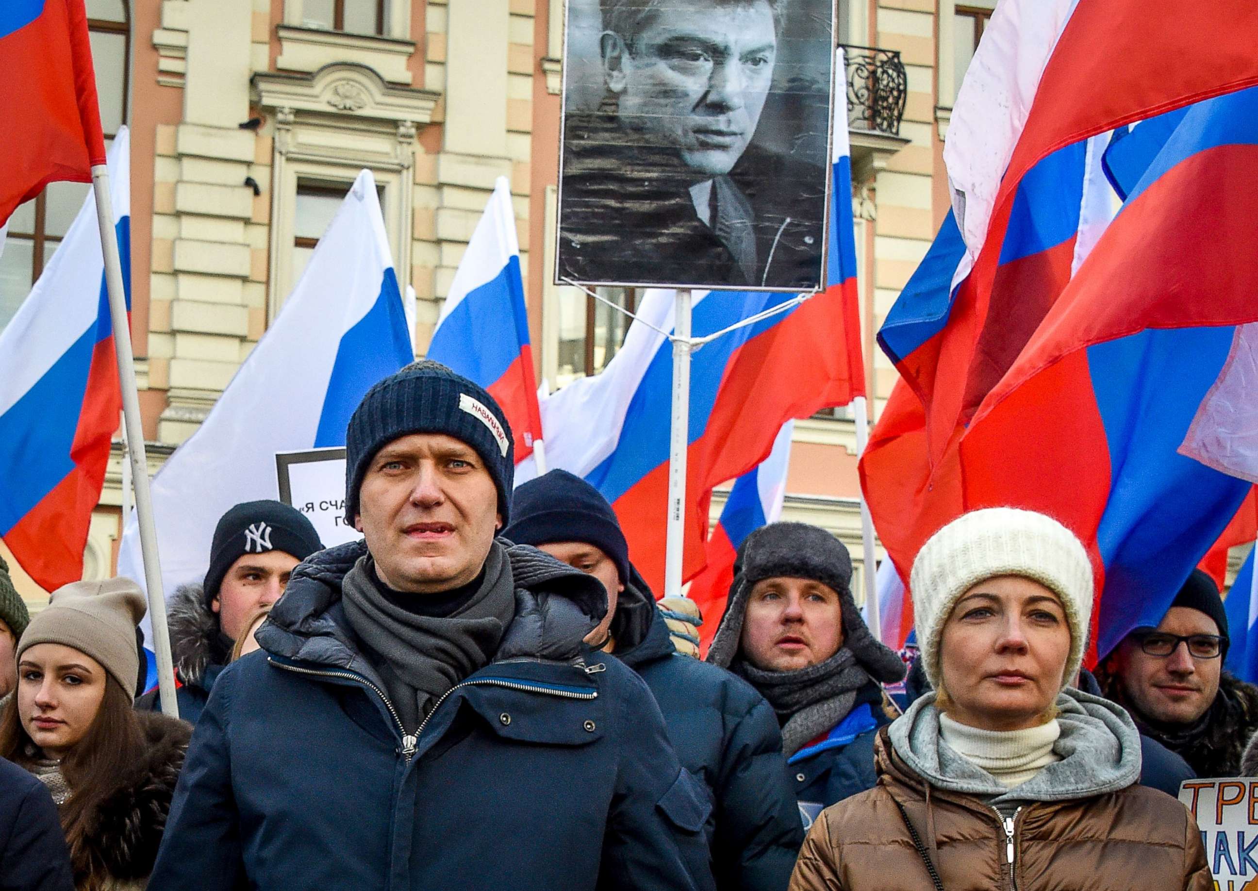 PHOTO: Russian opposition leader Alexey Navalny (L) and his wife Yulia (R) attend an opposition march in memory of murdered Kremlin critic Boris Nemtsov in central Moscow, Feb. 25, 2018. 