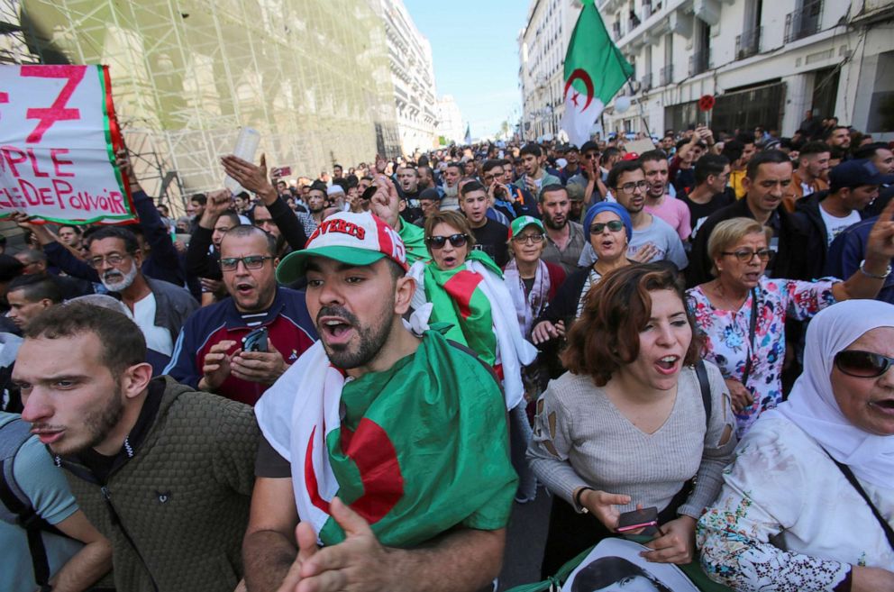 PHOTO: Demonstrators carry national flags and banners during a protest against the country's ruling elite and to demand an end to corruption and the army's withdrawal from politics in Algiers, Algeria, Oct. 29, 2019.