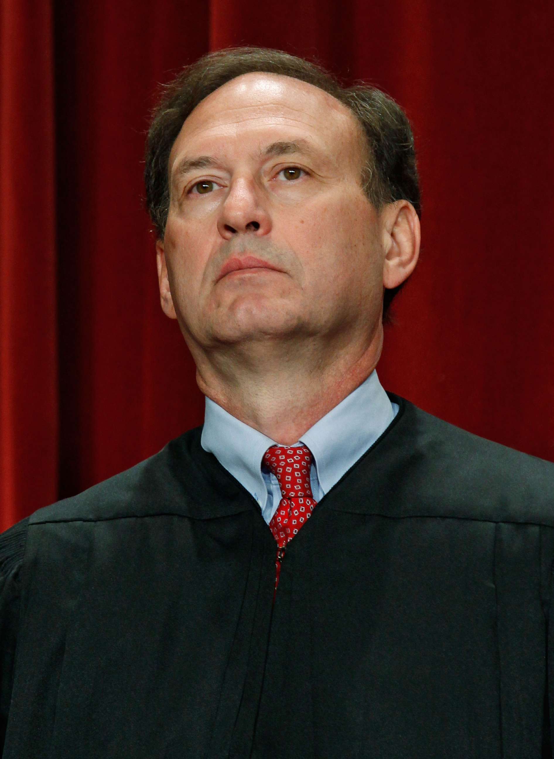 PHOTO: Associate Justice Samuel Alito Jr. poses for a group photograph at the U.S. Supreme Court building on Sept. 29, 2009 in Washington.