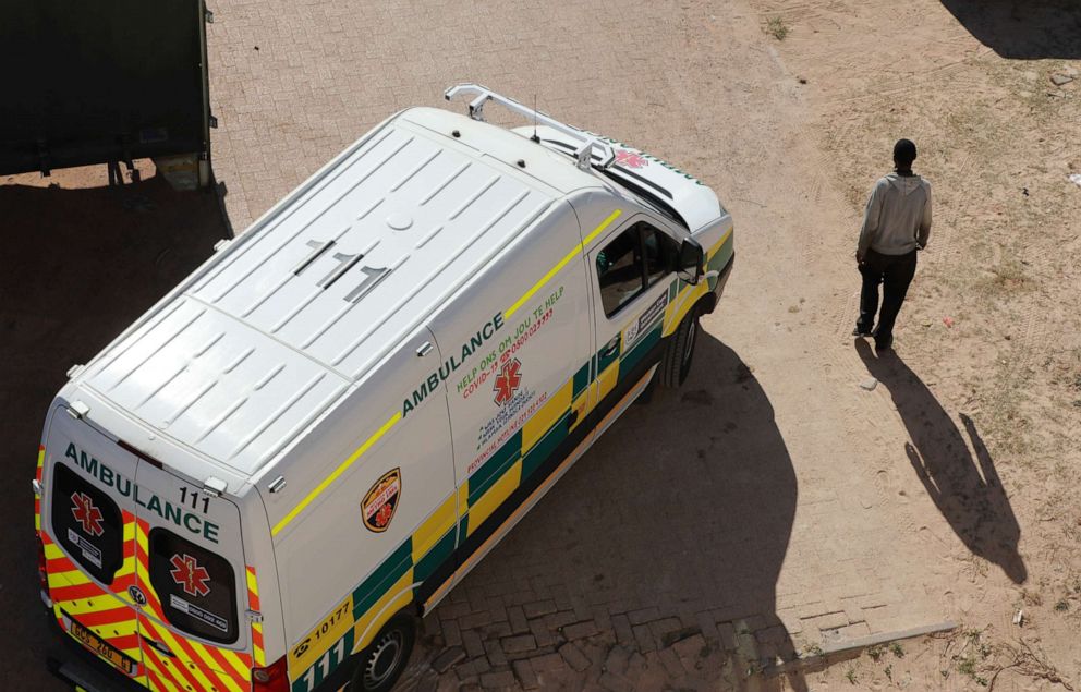 PHOTO: An ambulance passes a pedestrian in Khayelitsha township in Cape Town, South Africa, on May 19, 2020.