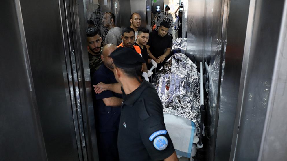 PHOTO: Medics transport the body of a U.S. citizen after she succumbed to her wound from a reported  gunshot, at a hospital in Nablus in the occupied West Bank on Sept. 6, 2024. 