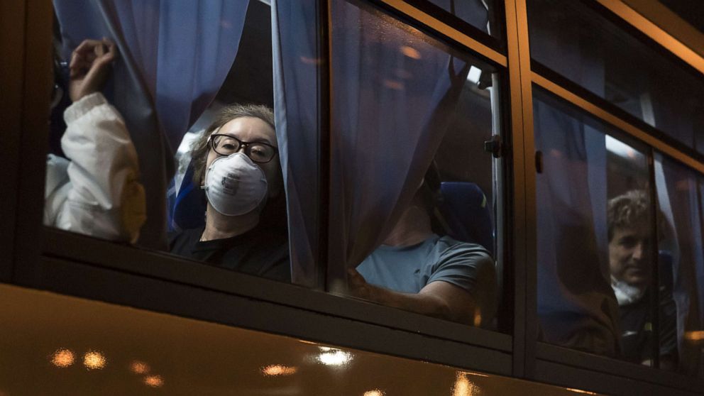 PHOTO: American citizens look out from a bus as they arrive at Haneda Airport in Tokyo, Japan, on Feb. 17, 2020.