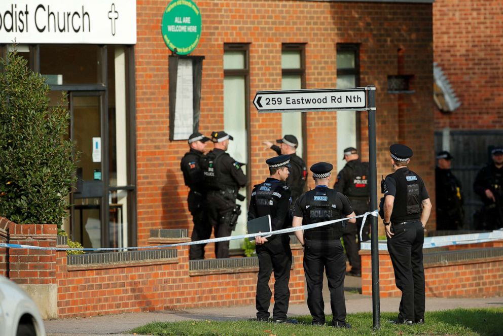 PHOTO: Police officers stand near Belfairs Methodist Church where MP David Amess was doing his monthly "meet and greet" with constituents and stabbed in Leigh-on-Sea, Britain on Oct. 15, 2021.