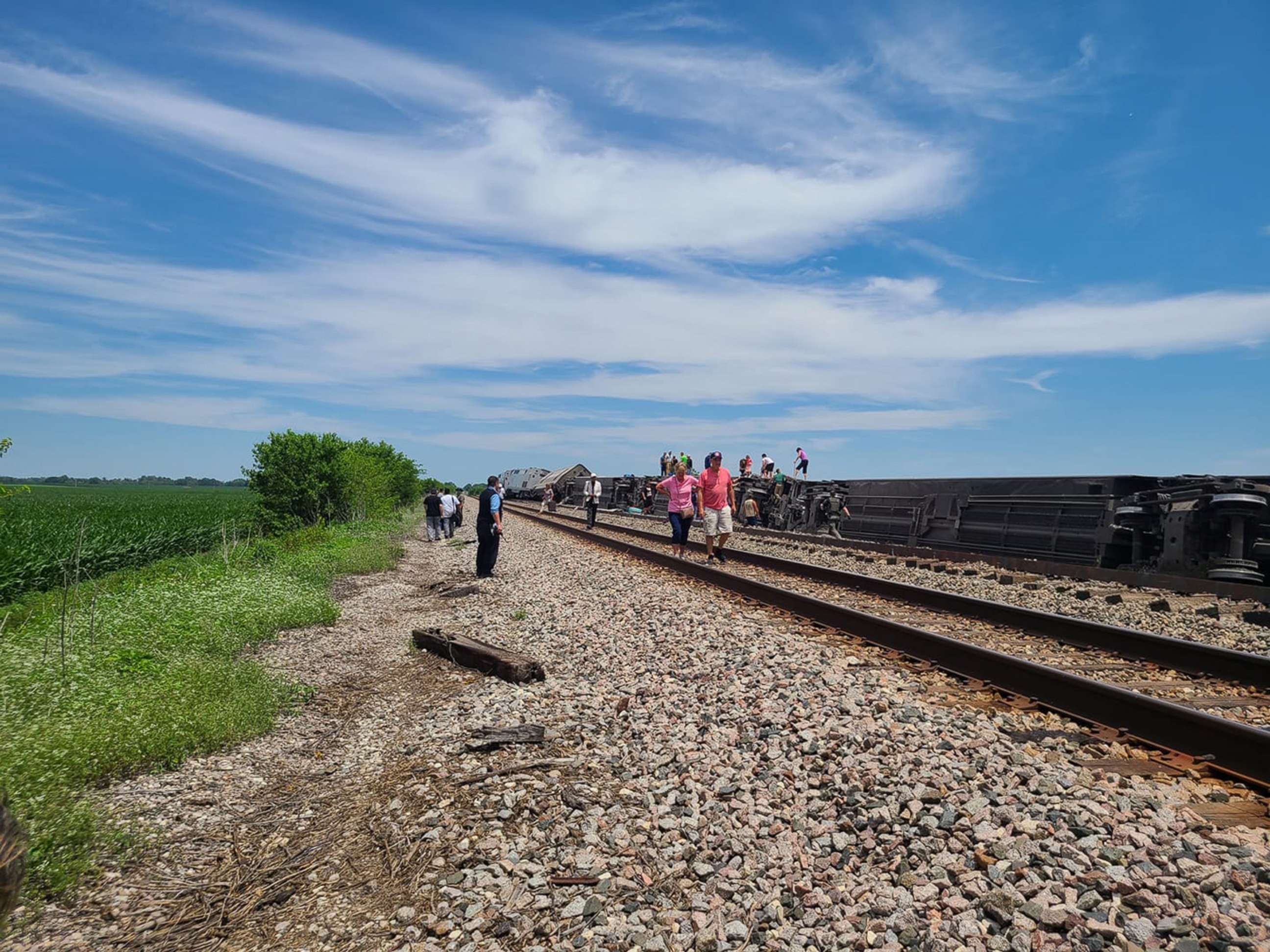 PHOTO: Responders examine the scene of Amtrak train derailment with passengers near Salisbury, Mo., June 27, 2022.