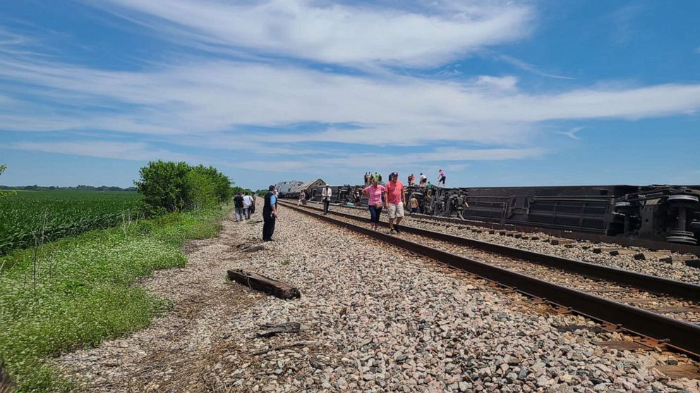 PHOTO: Responders examine the scene of Amtrak train derailment with passengers near Salisbury, Mo., June 27, 2022.