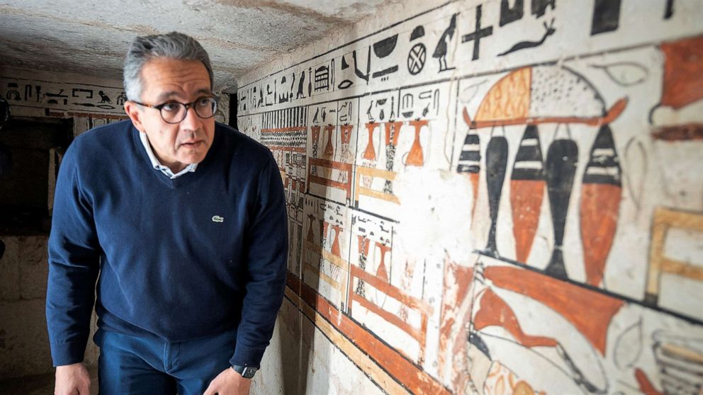 PHOTO: Egypt's antiquities and tourism minister Khaled el-Anany inspects one of the five ancient tombs discovered in Saqqara.