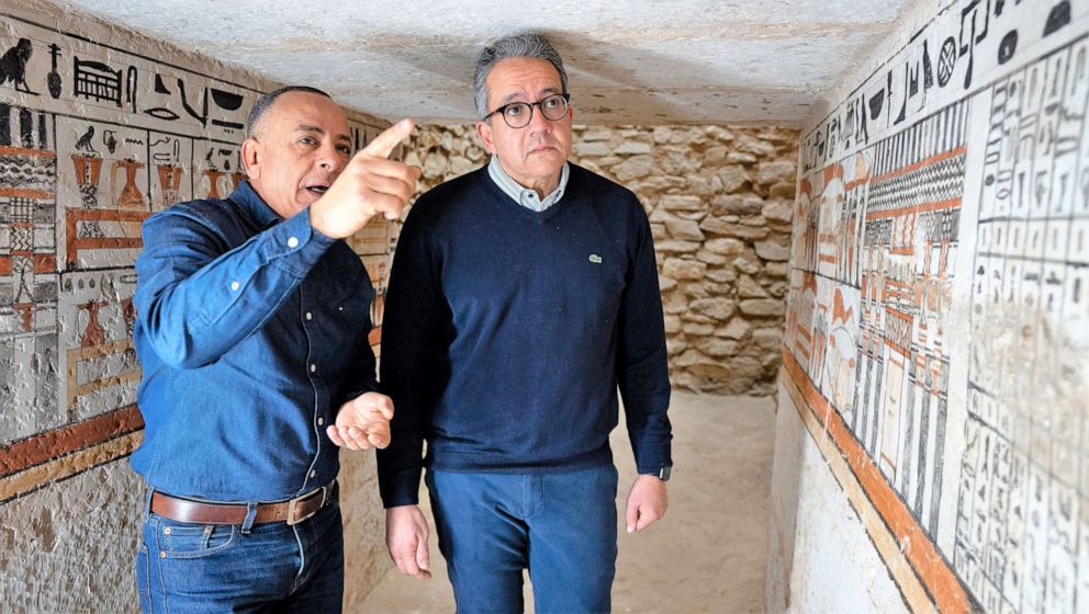 PHOTO: Egypt's antiquities and tourism minister, Khaled el-Anany (R), and Mostafa El-Waziri, the head of the country's Supreme Antiquities Council, inspect one of the five ancient tombs discovered in Saqqara, Egypt.