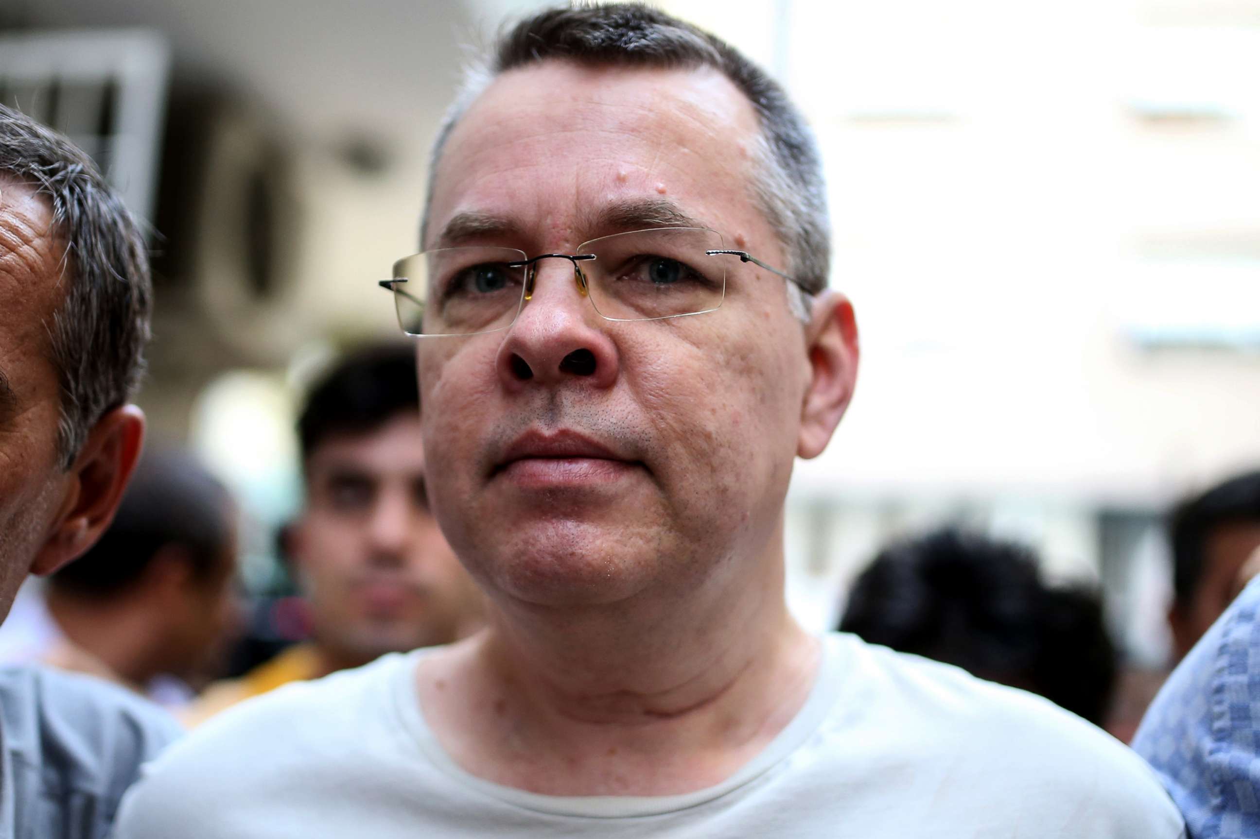 PHOTO: Andrew Craig Brunson is escorted by Turkish plain clothes police officers, July 25, 2018, in Izmir, Turkey.