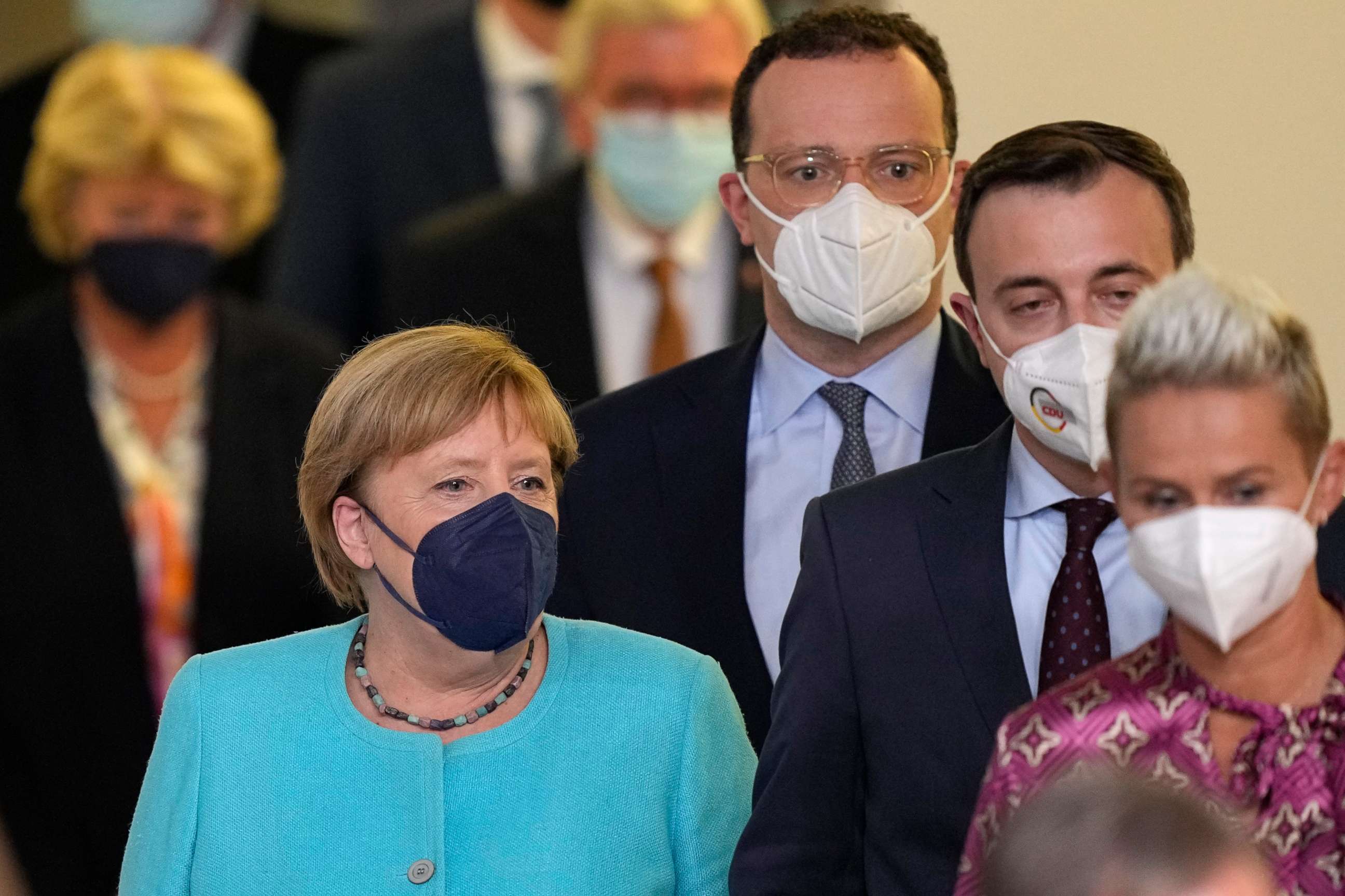 PHOTO: Chancellor Angela Merkel, left, arrives along with top party members after the German parliament elections at the Christian Democratic Union, CDU, party's headquarters in Berlin, Sunday, Sept. 26, 2021.