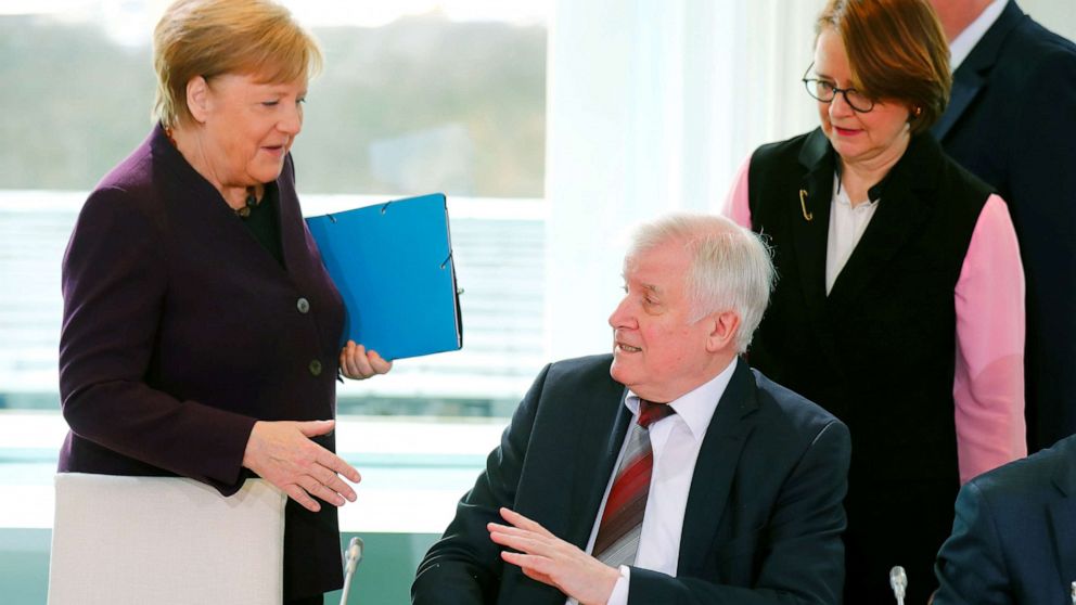 PHOTO: German Interior Minister Horst Seehofer refuses to shake the hand of German Chancellor Angela Merkel for hygienic reasons before a migration summit at the Chancellery in Berlin, Germany, March 2, 2020.