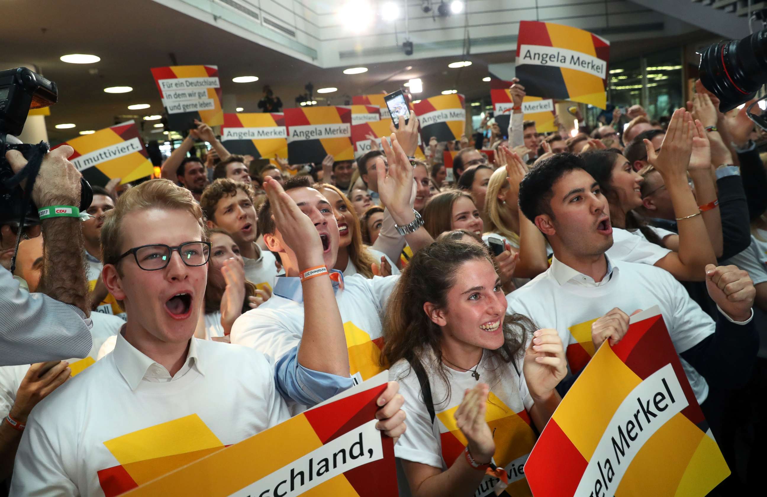 PHOTO: Supporters of the German Christian Democrats (CDU), the party of German Chancellor Angela Merkel, cheer while waiting for the initial results in German federal elections, Sept. 24, 2017 in Berlin, Germany. 