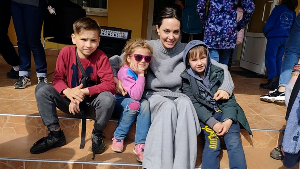 PHOTO: In this image provided by the Lviv city hall Angelina Jolie, Hollywood movie star and UNHCR goodwill ambassador, poses for photo with kids in Lviv, Ukraine, Saturday, Apr. 30, 2022.