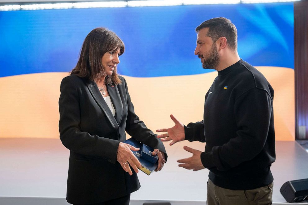 PHOTO: Ukrainian President Volodymyr Zelenskyy presents the Savior City award to Paris Mayor Anne Hidalgo, left, during the International Summit of Cities and Regions, on April 20, 2023, in Kyiv, Ukraine.