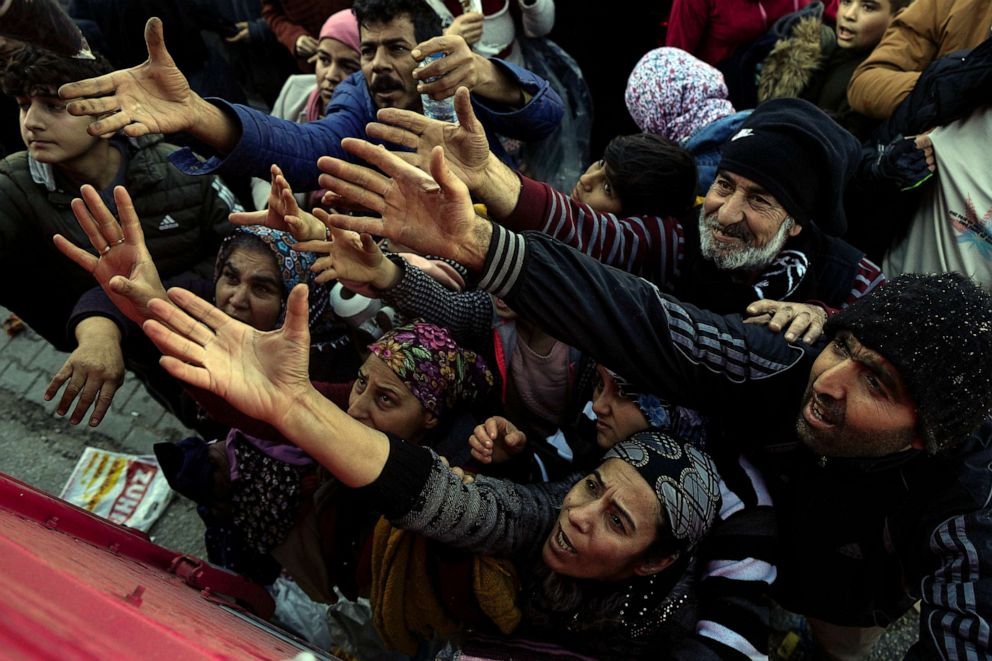 PHOTO: Volunteers distribute aid to people in Antakya, southern Turkey, Feb. 8, 2023.